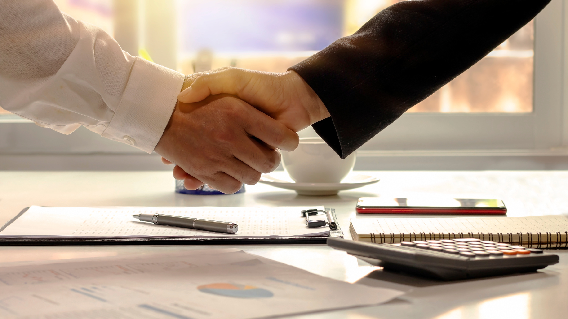 Business Partners Handshake after Contract Signing Agreement